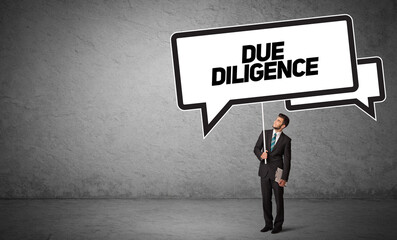 Obraz premium Young business person in casual holding road sign with DUE DILIGENCE inscription, new business idea concept