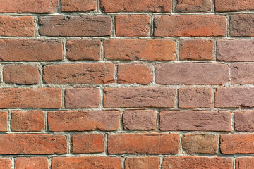 Obraz premium Old brick wall of a residential building. Red brick masonry.