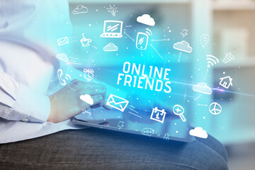 Close-up Of A Person Using Social Networking with ONLINE FRIENDS inscription