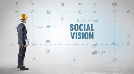 Engineer working on a new social media platform with SOCIAL VISION inscription concept