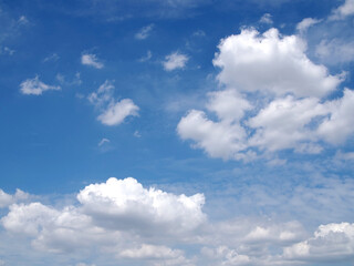 Naklejka na ściany i meble pure white fluffy clouds floating on sunshine sky, cloudscape background