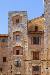 Fototapeta premium Facade of the medieval building in San Gimignano Tuscany, Italy