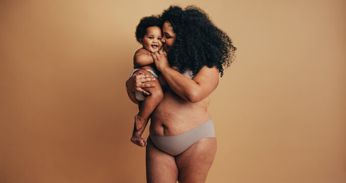 Plus size woman with her baby
