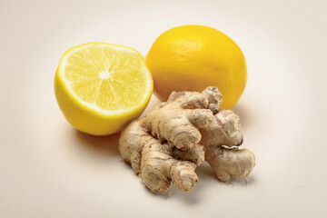 Close-up of ginger and lemon on a light beige background