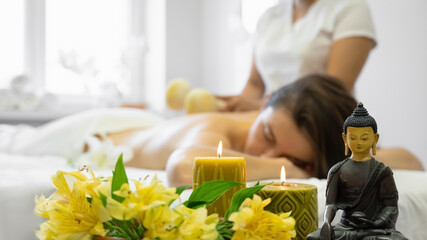 Obraz na płótnie Canvas Vietnamese herbal massage in spa salon