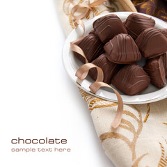 Chocolate candy with sweet cream inside on the white background