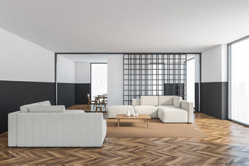 Black and white open space studio, furniture on wooden floor