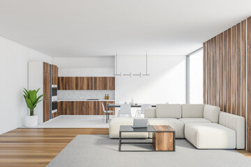 Naklejka na ściany i meble White living room with sofa near window and kitchen set on background