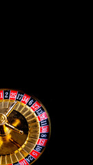 casino games: spinning roulette on black background