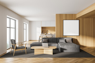 White and wooden living room with sofa and poster