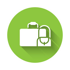 White Suitcase for travel icon isolated with long shadow. Traveling baggage sign. Travel luggage icon. Green circle button. Vector.