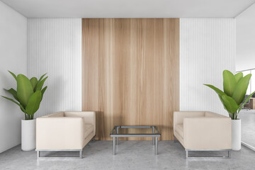 Office waiting room with two white armchairs, coffee table and plants