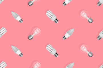Light bulb seamless pattern. Lighting bulbs on a red background.