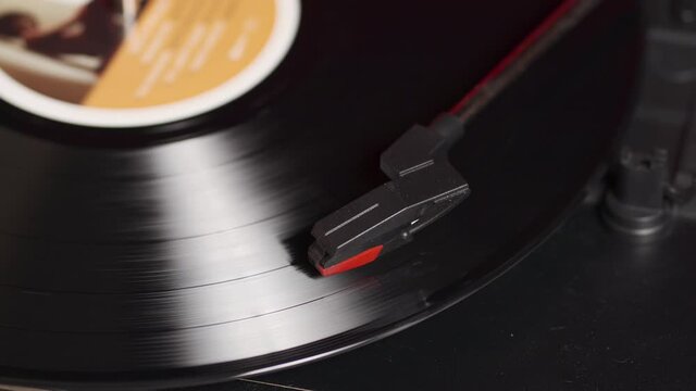 Vintage turntable plays the record