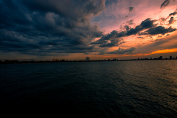 The background of the bridge stretches into the sea, with twilight light in the morning, beautiful colors, sky wallpaper and refreshing surroundings.