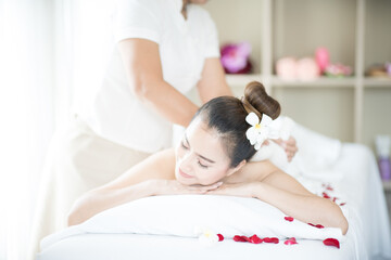 Traditional massage from natural herb and spa for woman. A young woman massaging the spa in the spa room.