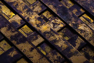 Selective focus close up copper bar grid textured