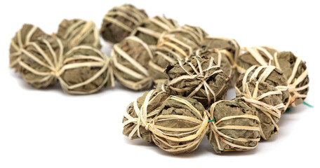 Close up of balls of dried tea leaves