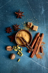 Set of winter spices : cinnamon, anise, cardamon, nutmeg, clove, vanilla and brown sugar .Top view...