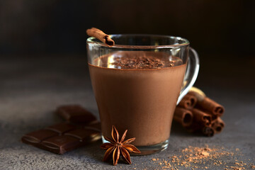 Spicy hot chocolate in a glass cup.