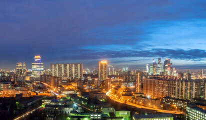Naklejka na ściany i meble The panoramic view of the big city lights. Amazing view of twilight and sunset horizon.
