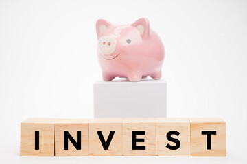 A pink piggy bank on isolated white background. Savings or investment concept.