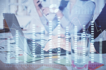 Multi exposure of woman hands typing on computer and forex chart hologram drawing. Stock market analysis concept.