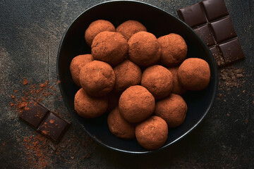 Homemade delicious chocolate rum truffles. Top view with copy space.