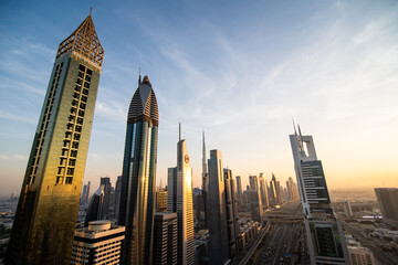 Fototapeta na wymiar UAE, Dubai - December, 2020: Sheikh Zayed Road, a 7 lane highway, showing some of Dubai's famous skyscrapers.