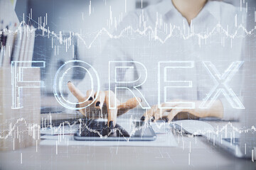Double exposure of forex chart sketch hologram and woman holding and using a mobile device. Financial market concept.
