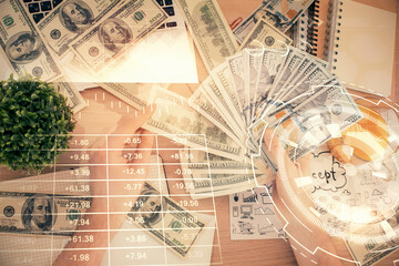 Multi exposure of financial graph drawing hologram and USA dollars bills and man hands. Analysis concept.