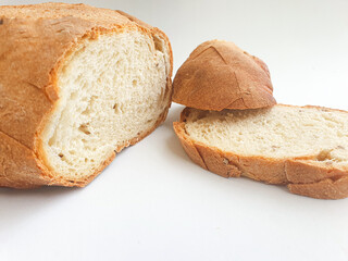 sliced bread. Closeup freshly baked homemade traditional bread on white background. Concept - Cooking at Home