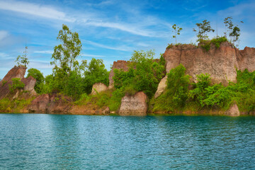 Fototapeta na wymiar Hidden view of blue pond in kamphaeng phet for travel