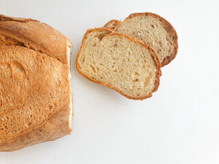 loaf of bread.  Closeup freshly baked homemade traditional bread on white background. Concept - Cooking at Home