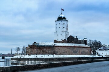 Fototapeta premium Russia, Vyborg, January 2021. Panorama of the castle from the bridge over the bay.