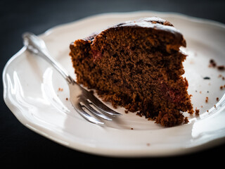 Brownie - chocolate cake on black background 