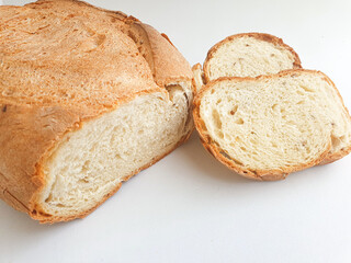 loaf of bread. Closeup freshly baked homemade traditional bread on white background. Concept - Cooking at Home