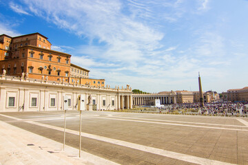 Fototapeta na wymiar St. Peter's Square in Vatican City, Rome. View from the St. Peter's Basilica, architectural masterpiece with Michelangelo's dome. Famous Italian landmark