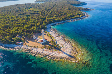 Old lighthouse of Veli Rat on the island of Dugi Otok, Adriatic sea horizon in background, beautiful Croatia