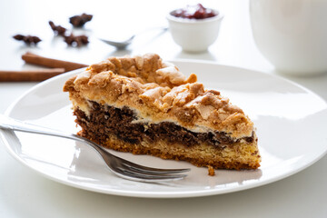 Chocolate cake with meringue on white background
