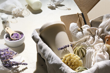 Hand made lavender sachets in textile bags and soft hearts. Hand hold raft cardboard parcel with...
