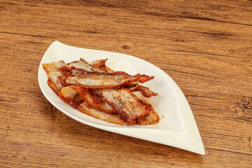 Roasted juicy bacon in the plate