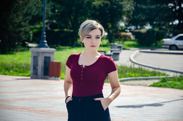 A girl walks on the street in the square