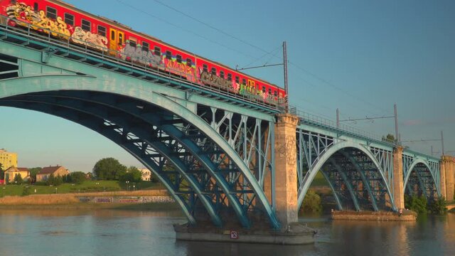 Train on railway on bridge over river