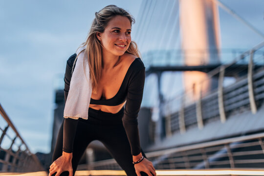 active woman doing early morning exercise outdoors