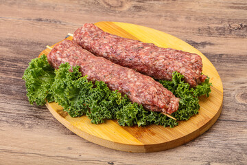Raw minced beef kebab skewer
