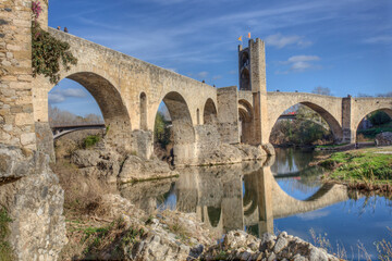 Fototapeta na wymiar Fluvia riverside with medieval bridge at bottom, Besalu, Spain
