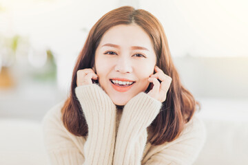 closeup young woman  smile and relax  at home in winter