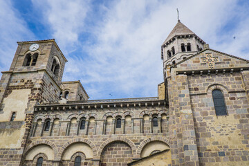 Fototapeta na wymiar view of the 12th century romanesque church of the small town of Saint Nectaire in Auvergne, France