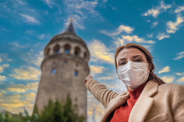 Portrait of beautiful girl wearing protective medical mask